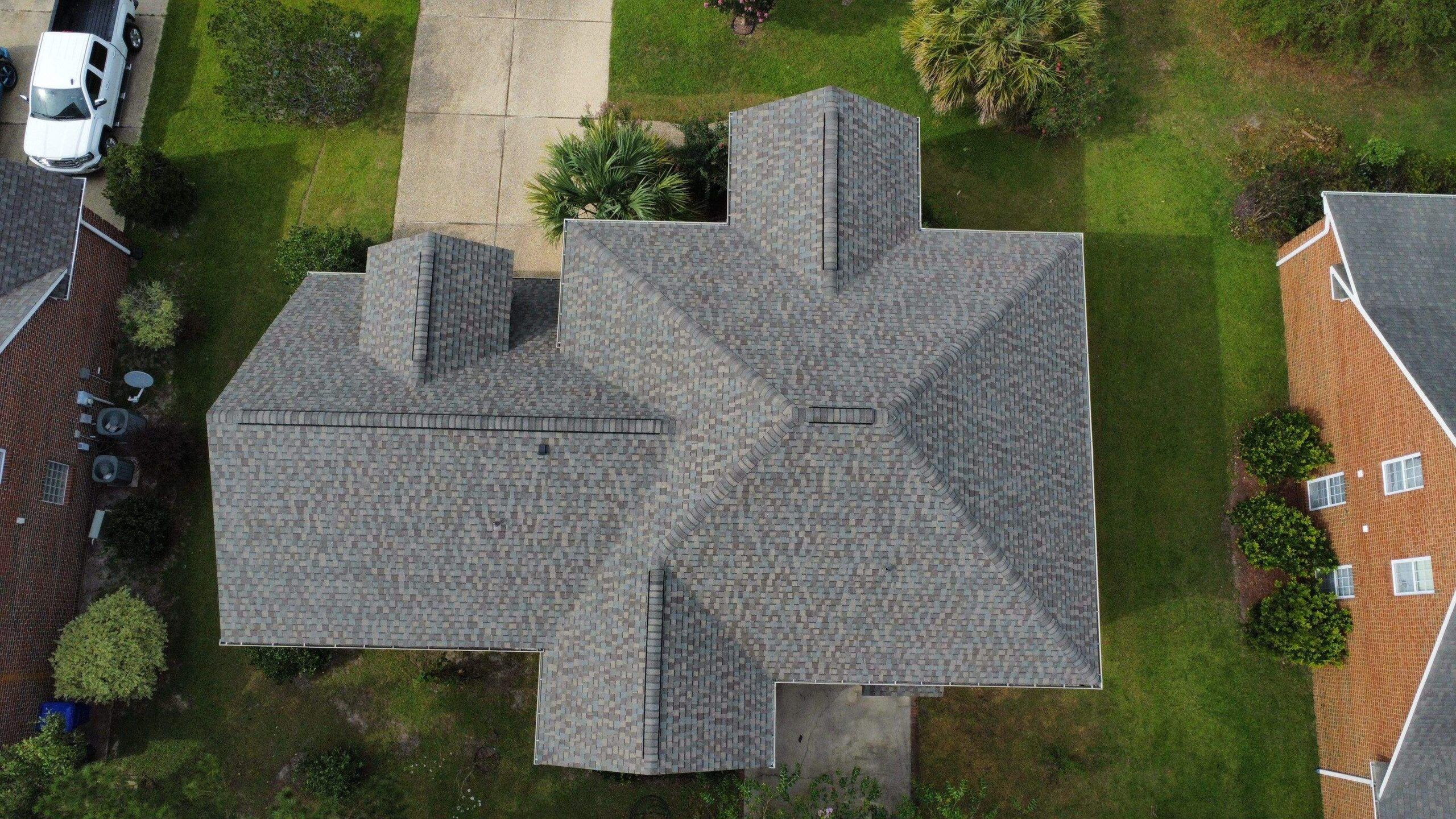 A new gray shingle roof seen straight down from a drone